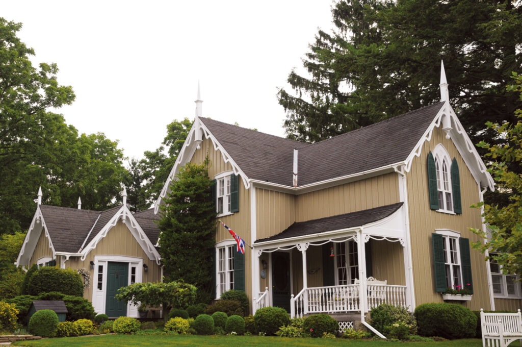 Freshly painted house exterior. Painted yellow brown and green by Moonlight Painters